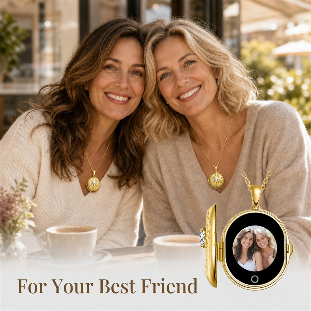 Two smiling women seated at a cafe table, each wearing totwoo gold pendant locket necklace. One necklace pendant is shown enlarged in the lower right with a photo display inside, and the text 'For Your Best Friend' appears at the bottom.