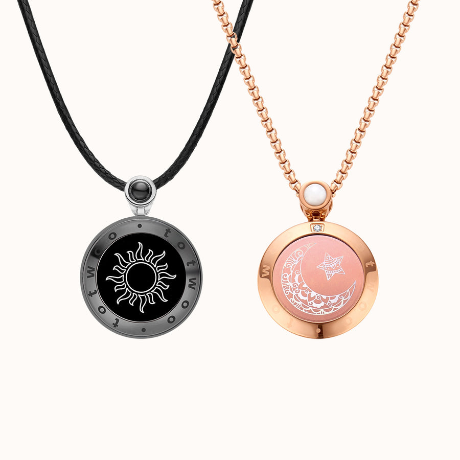 The two Sun & Moon touch necklaces: a black Sun on cord and a rose gold Moon on chain
